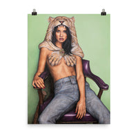 An 18 inch by 24 inch museum quality liana z weber artworks original poster. beautiful and affordable wall art of a strong female sitting, leaning back in a purple chair against a soft light green background. She is wearing a lion headdress and is staring boldly at the viewer. She is the female version of the legendary mythological character Hercules. A strong and badass woman that needs no one and is self assured.