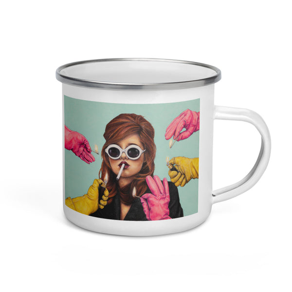 white enamel mug with art of lady smoking while pink & yellow gloves offer a light on dusty blue